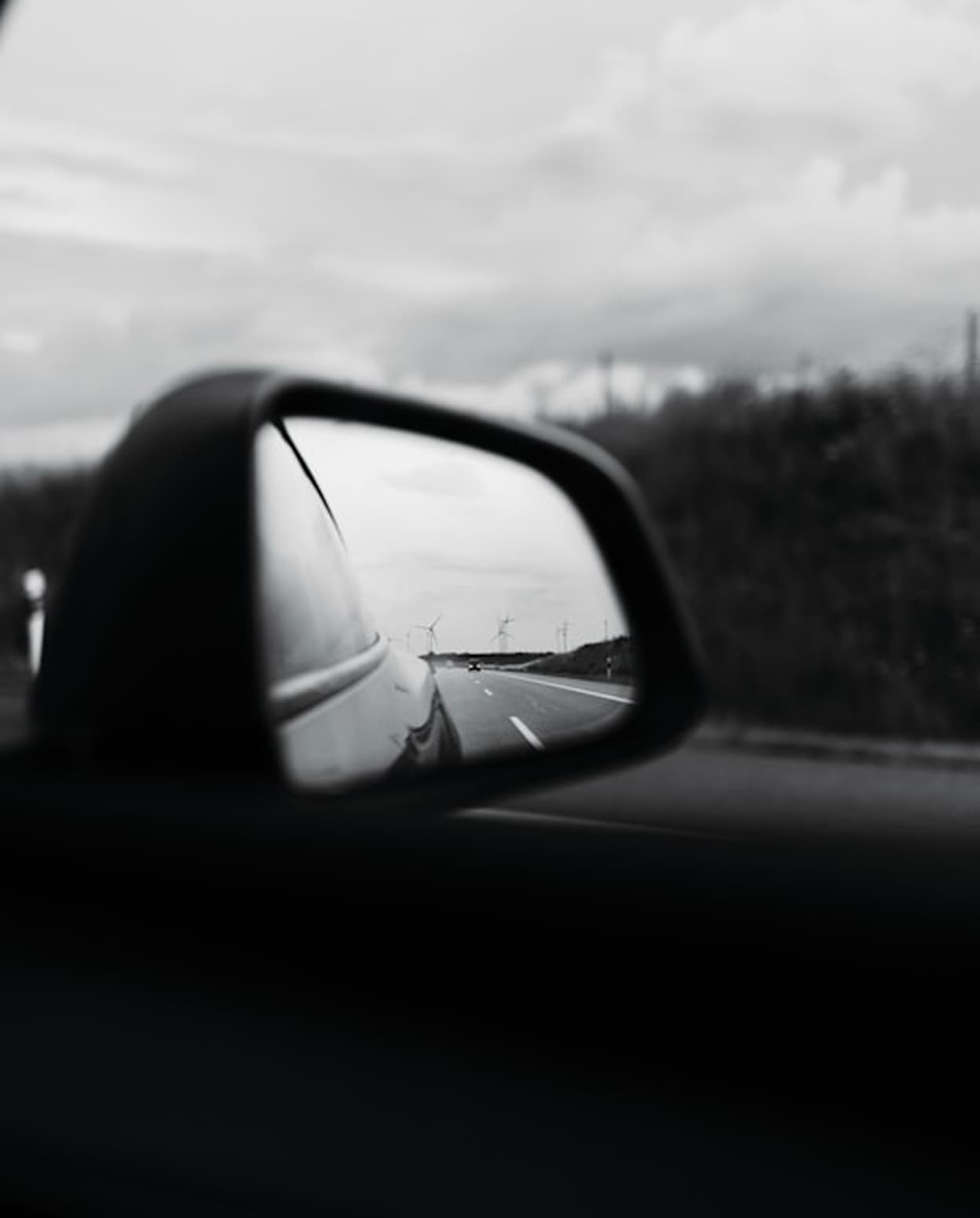 Reflection in a car side mirror